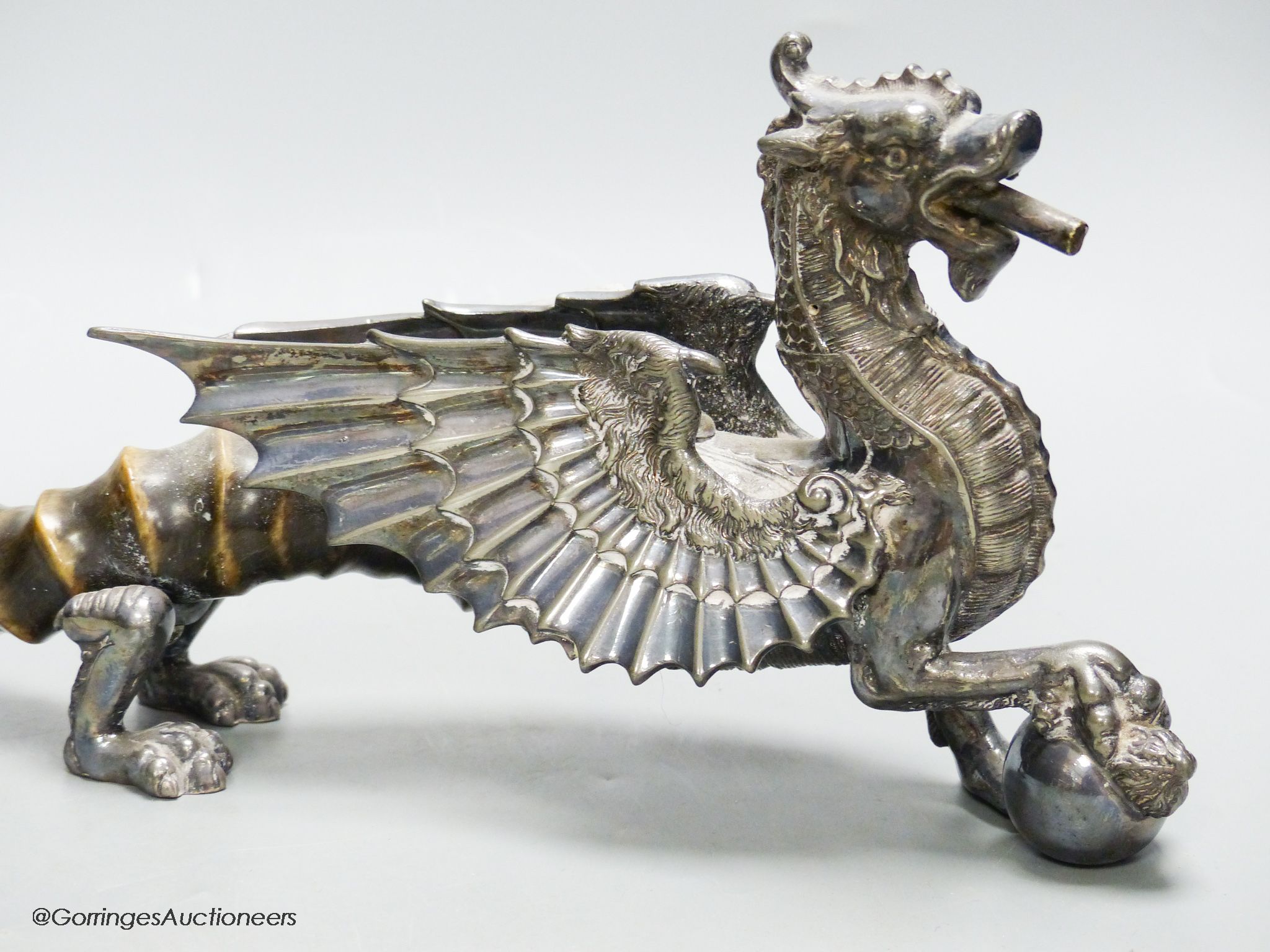 An Edwardian plated Welsh Dragon club lighter, with antler tail, length 46cm